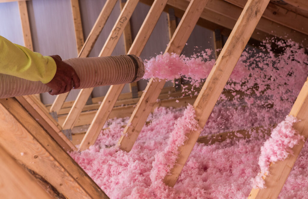 Pink blown insulation in an attic
