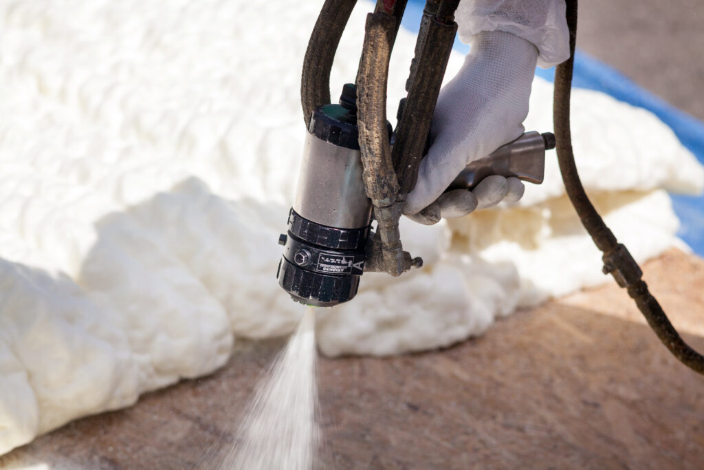 Spraying foam insulation with equipment